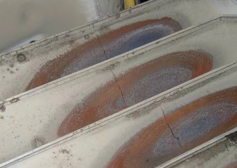 Cracked furnace heat exchanger cells with heat discoloration, the kind of finding a LaPorte County furnace diagnosis must confirm